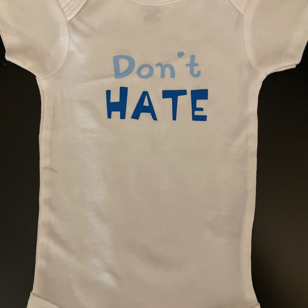 Vinyl print baby onesie.